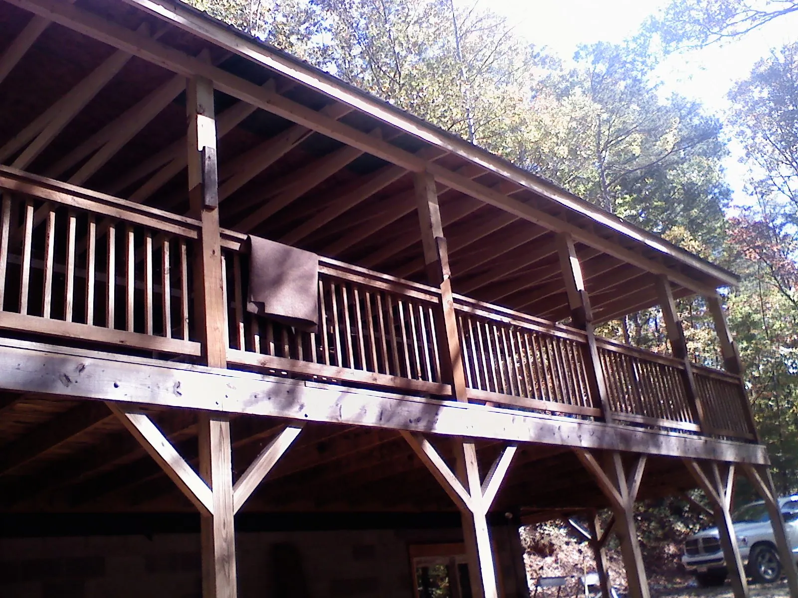 Timber framing under a new elevated porch and deck — Roof Leak Repair in Luck by Roofing Brothers